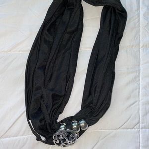 Black scarf with metal piece